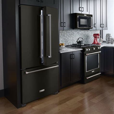 color cabinets and black stainless steel appliances|black fridge in white kitchen.